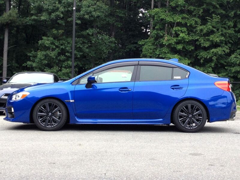 HKS HIPERMAX S coilover suspension kit installed on a Subaru WRX STI, showcasing adjustable shock absorbers and performance components.