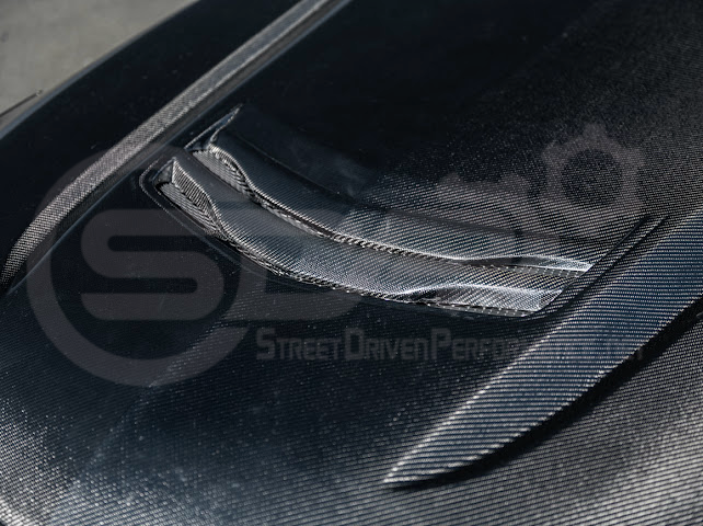 Cadillac CT4 Blackwing style carbon fiber vented front hood with aggressive design for 2020+ models, by Street Driven Performance.