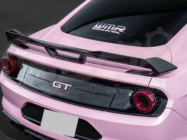 Dark Horse style carbon fiber rear wickerbill spoiler wing on a 2015-2023 Ford Mustang, showcasing sleek aerodynamic design.