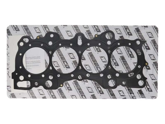 Wiseco Honda B16A2/B16A3/B17A1/B18C1 cylinder head gasket kit showing gasket components laid out on a surface.