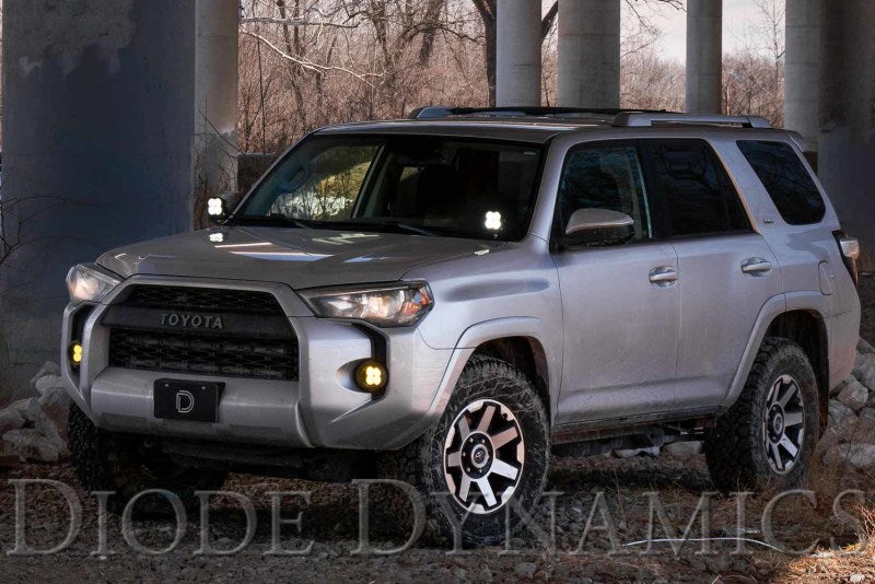 Diode Dynamics Toyota 4Runner Stage Series 2in LED ditch light kit with sport yellow and white combo lights mounted on vehicle.