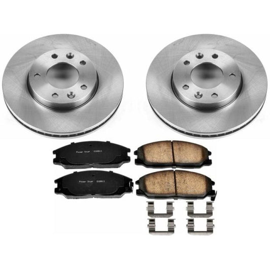 PowerStop OE brake kit for 2004-2005 Kia Sedona front brakes, including brake rotors and pads, installed on vehicle.