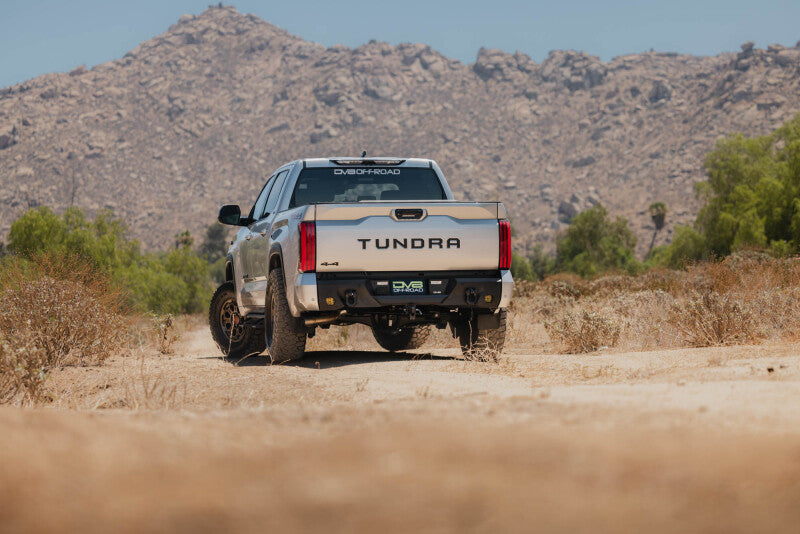 Steel rear bumper for Toyota Tundra DV8 Offroad Spec Series, durable black bumper with mounting points and offroad protection.
