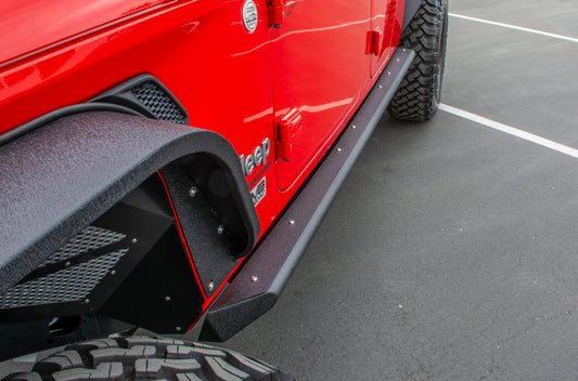 DV8 Offroad Jeep Gladiator side steps and sliders installed along the vehicle's side for easy access and protection.