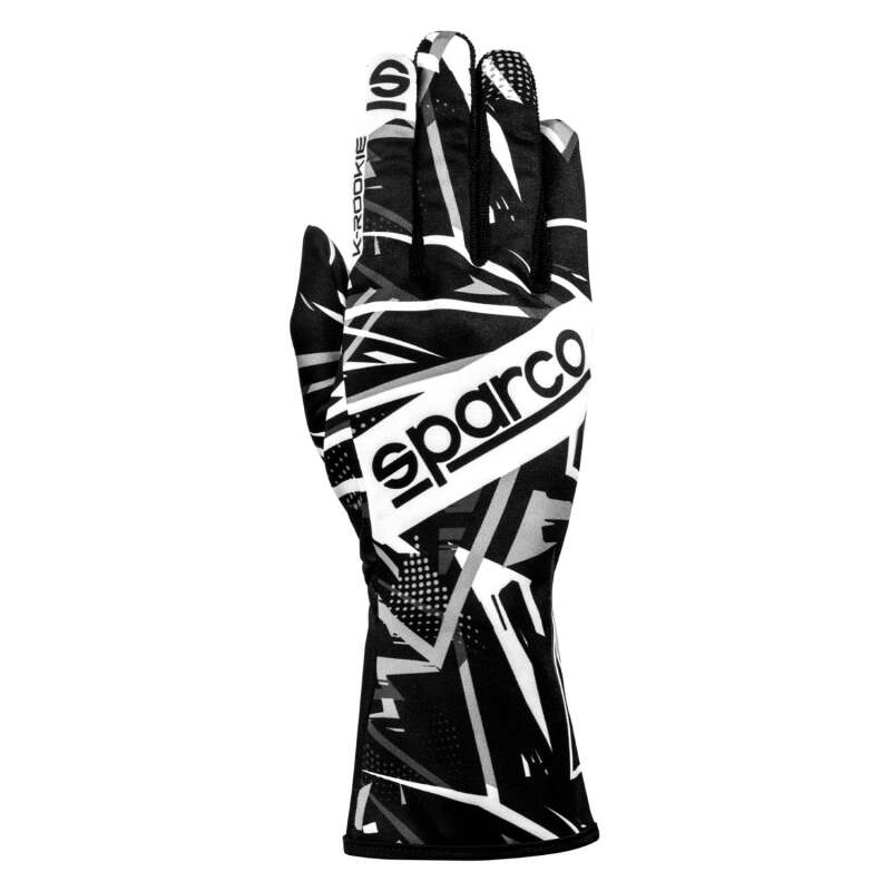 Black and white Sparco K-Rookie 7 racing gloves with padded palms and adjustable wrist straps for racing comfort and grip.