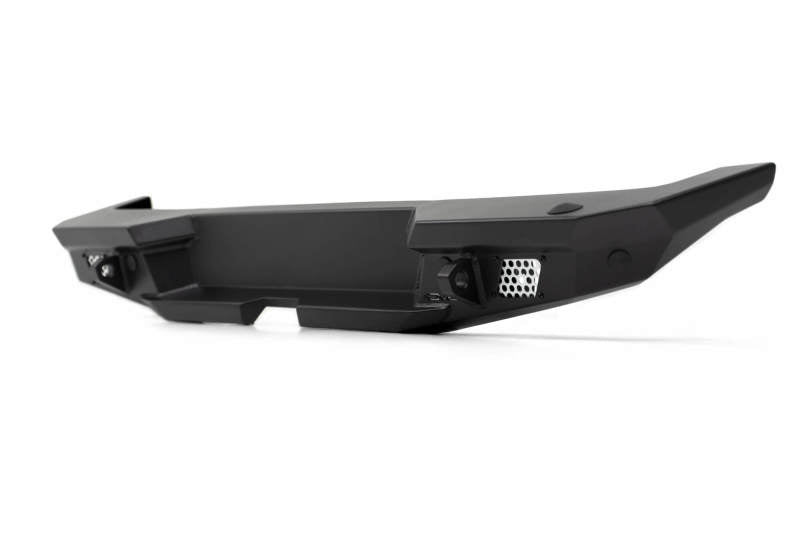 Steel rear bumper for 2018 Jeep Wrangler JL by DV8 Offroad with optional tire carrier, rugged off-road vehicle accessory.