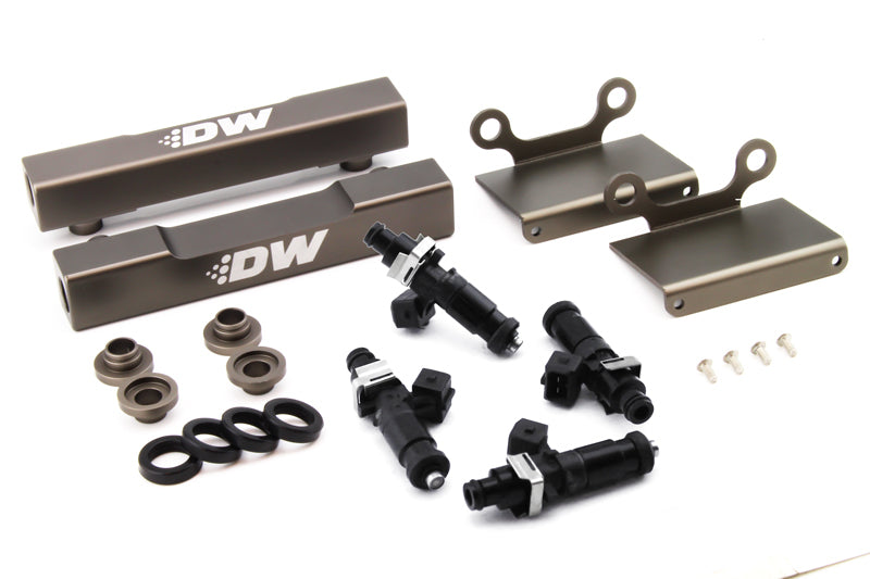 DeatschWerks fuel rail conversion kit with 1200cc injectors for 04-06 Subaru STI and LGT, showing side feed to top feed setup.