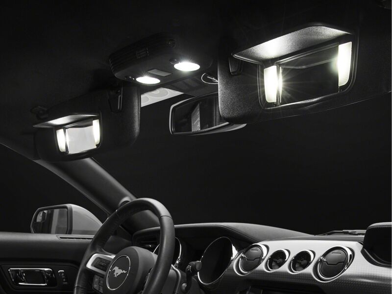 Raxiom Ford Mustang Axial Series Stage 2 interior LED lighting kit in cool white, showing LED strips installed inside the vehicle.
