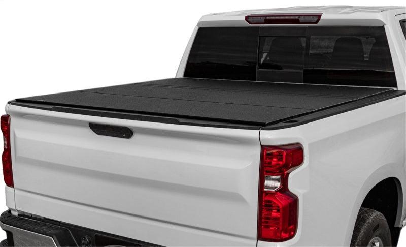 Access LOMAX tri-fold truck bed cover in black urethane finish on a 19+ Chevrolet Silverado 1500 with 6ft 6in bed.