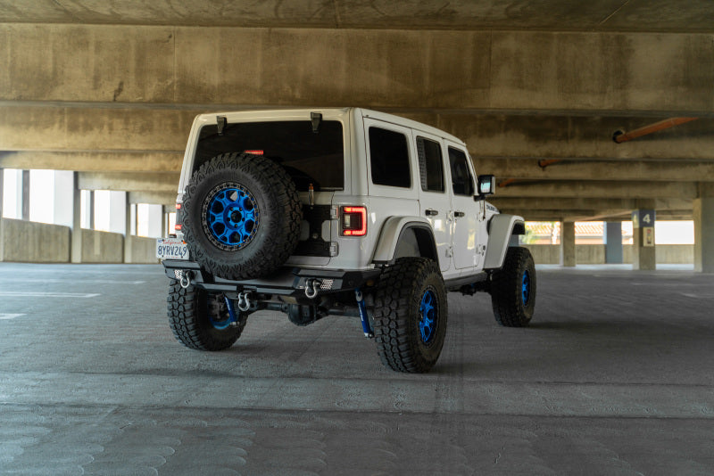 Steel rear bumper for 2018 Jeep Wrangler JL by DV8 Offroad, MTO Series with optional tire carrier attached.