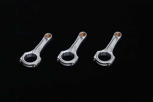 HKS G16E HC-TT connecting rod and piston kit with conrods, showcasing metal components for engine upgrade or repair.