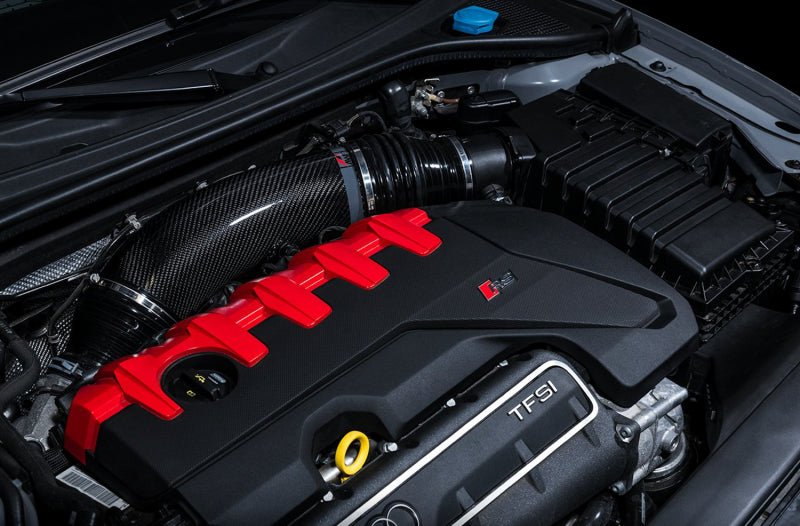 AWE Tuning cold air intake S-FLO carbon inlet tube for Audi RS3 and TT RS, showing the sleek black carbon fiber design.