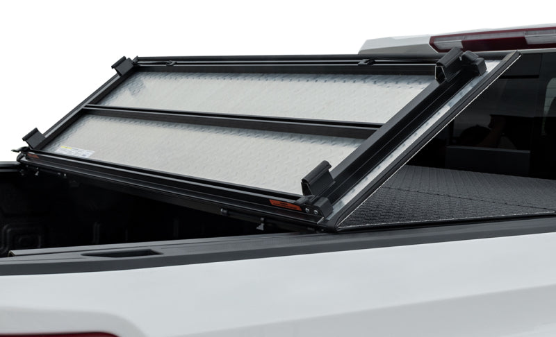 Access LOMAX Pro Series tri-fold hard tonneau cover for Chevy/GMC 1500 6ft 6in bed in black diamond mist finish.