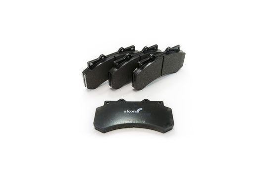 Alcon 2010+ Ford F-150 front performance brake pad set showing black brake pads with metal backing plates.