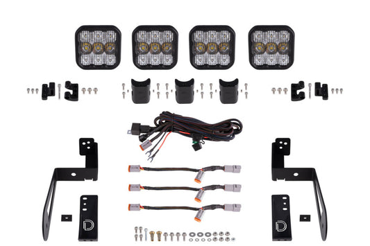 Diode Dynamics Jeep JK SS5 4-Pod CrossLink grille lightbar kit with white and combo LED lights on the vehicle front grille.