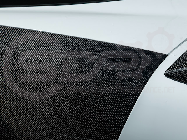 Factory style carbon fiber front and rear widebody fenders for 1997-2004 Chevrolet Corvette C5 hatchback by Street Driven Performance.