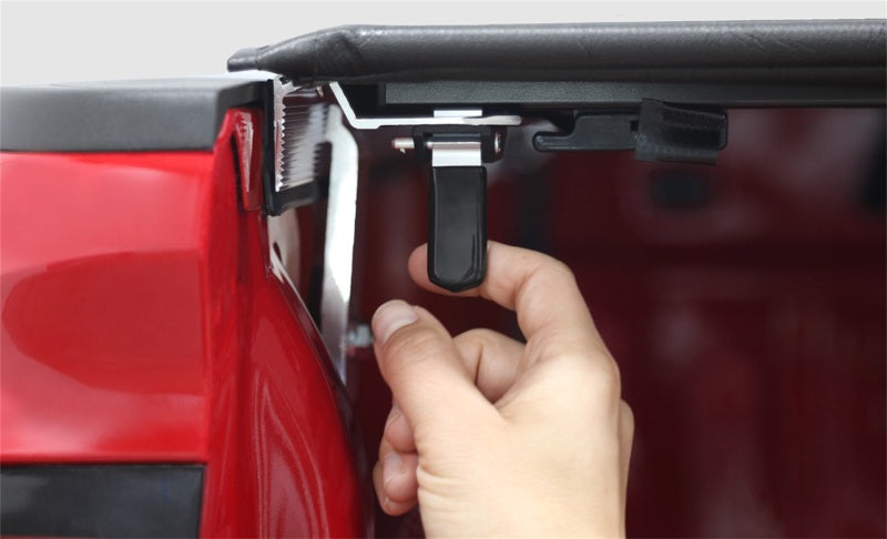 Access Tonnosport roll-up truck bed cover on a 2016-2019 Tacoma 5ft bed, exterior view showing the black fabric cover.