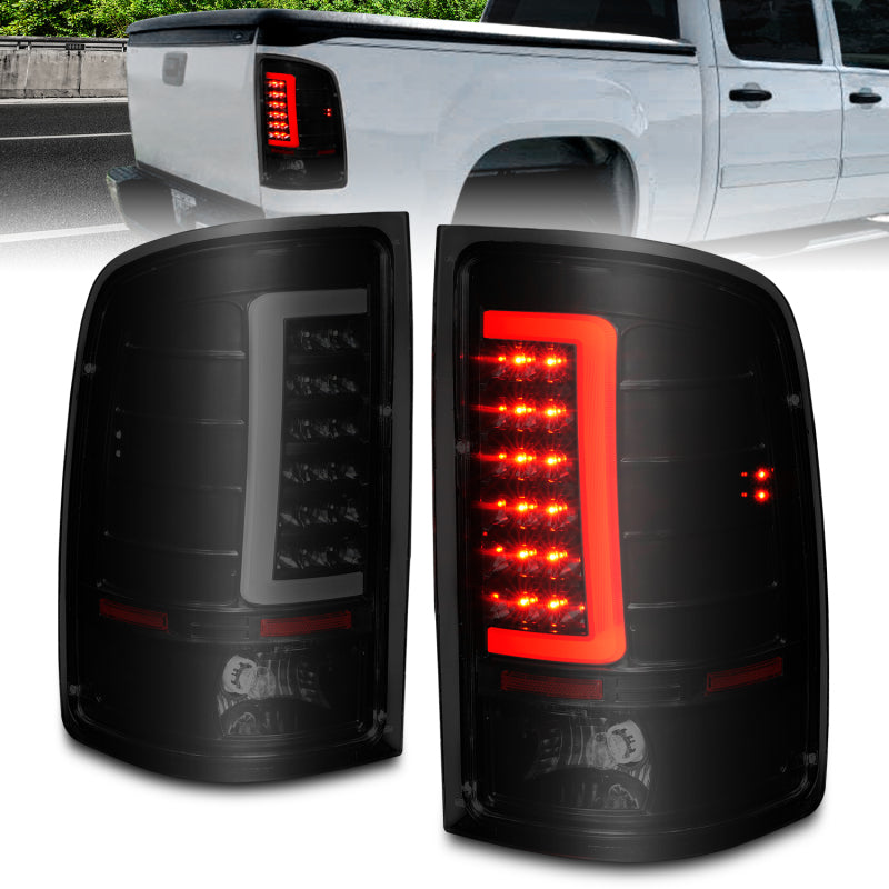 ANZO black housing smoke lens LED tail lights with light bar for 2007-2013 GMC Sierra pickup truck.