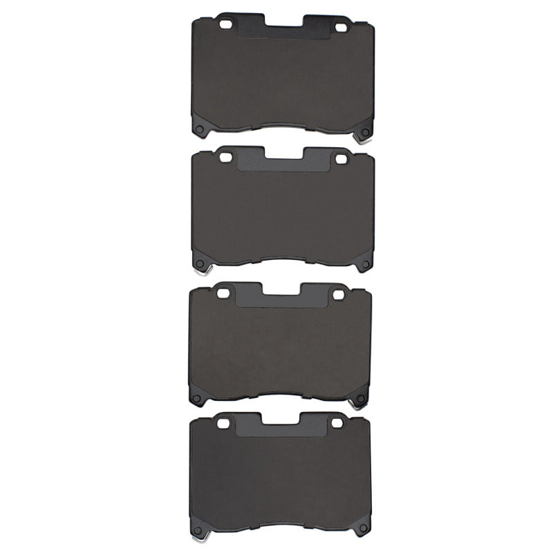 R1 Concepts Toyota Supra R1 93-98 front OE brake pads with metal backing and friction material, installed on brake caliper.