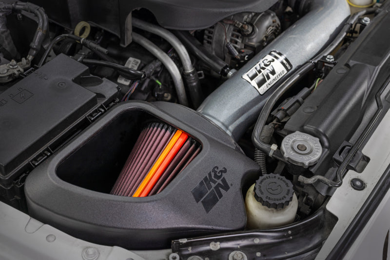 K&N Engineering aluminum cold air intake for 2012-2018 Jeep Wrangler NextGen, showing the black intake tube and filter.