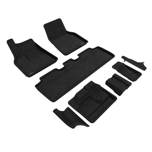 Black 3D MAXpider 7-seat Tesla Model Y floor mats, carpeted interior, covering first, second, and third-row seating areas.
