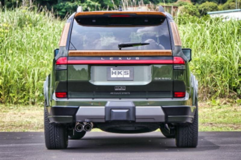 HKS Legamax Trail Master catback exhaust system installed on a Lexus GX550, showcasing the stainless steel muffler and piping.