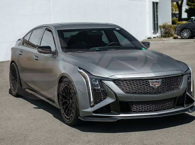 Cadillac CT5-V Blackwing factory OEM style carbon fiber front lip splitter, ground effects, and wheel arches for enhanced sporty appearance.