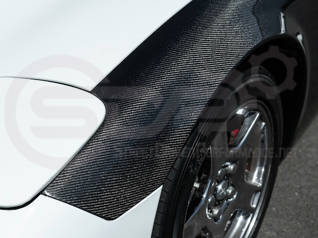 Factory style carbon fiber front and rear widebody fenders for 1997-2004 Chevrolet Corvette C5 hatchback by Street Driven Performance.