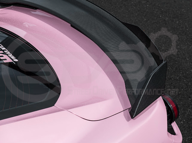 Dark Horse style carbon fiber rear wickerbill spoiler wing on a 2015-2023 Ford Mustang, featuring sleek aerodynamic design.