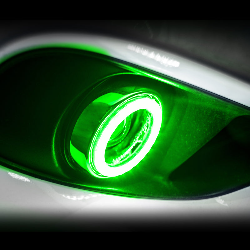 Oracle GTO fog lights with green surface mount LED halo kit installed, showcasing bright green LED rings around fog light housing.