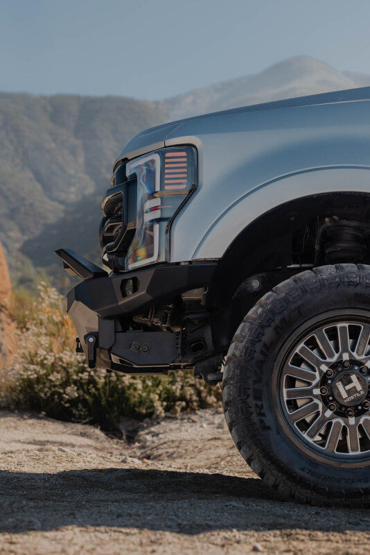 Steel front bumper for Ford Super Duty F-250/F-350 by DV8 Offroad, part of the Spec Series, designed for durability and off-road use.