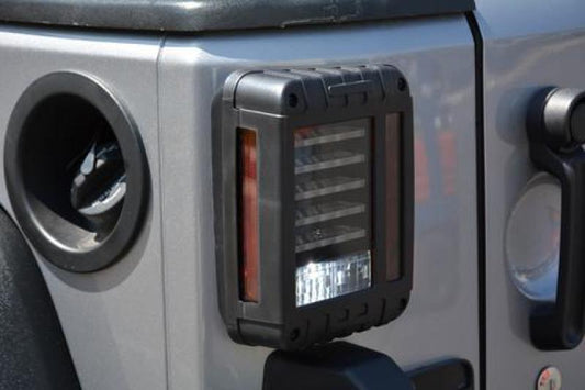 DV8 Offroad Jeep Wrangler JK LED tail light showing horizontal design and red lens for 2007-2018 Jeep Wrangler JK vehicles.
