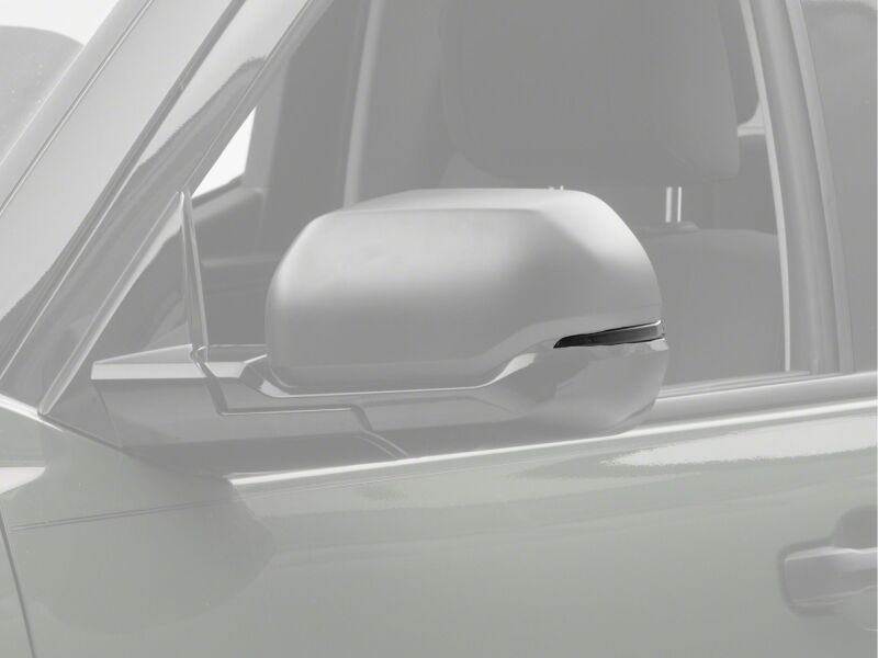 Raxiom smoked LED mirror lights installed on a Toyota Tundra side mirrors, showcasing sequential LED illumination.