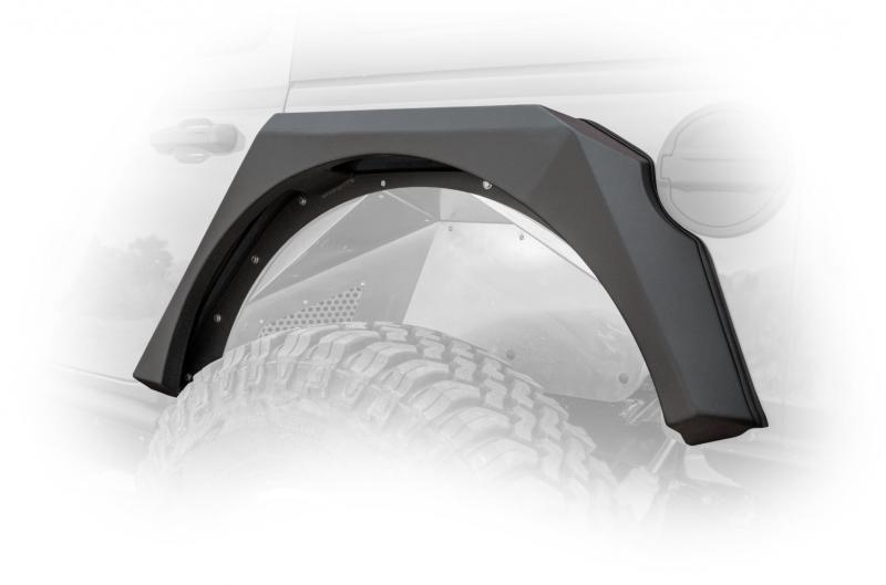 DV8 Offroad Jeep Wrangler JL armor fenders with LED turn signal lights installed on the vehicle's front wheel arches.
