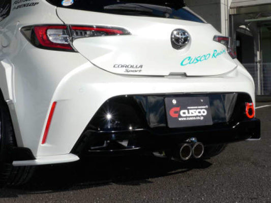Cusco Strut 19+ Toyota Corolla Hatchback rear lip spoiler in primer, showing its unpainted, aerodynamic design for enhanced sporty look.