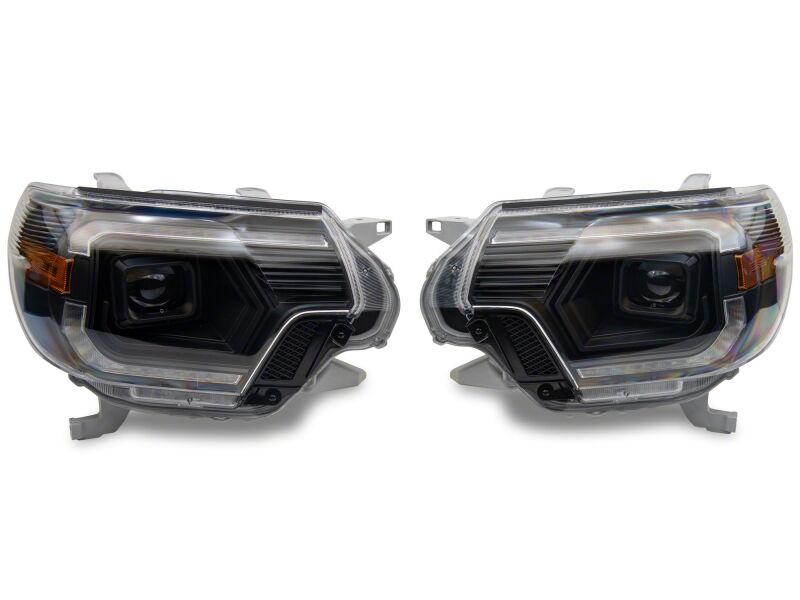 Raxiom Toyota Tacoma axial series projector headlights with black housing and clear lens for 2012-2015 models.