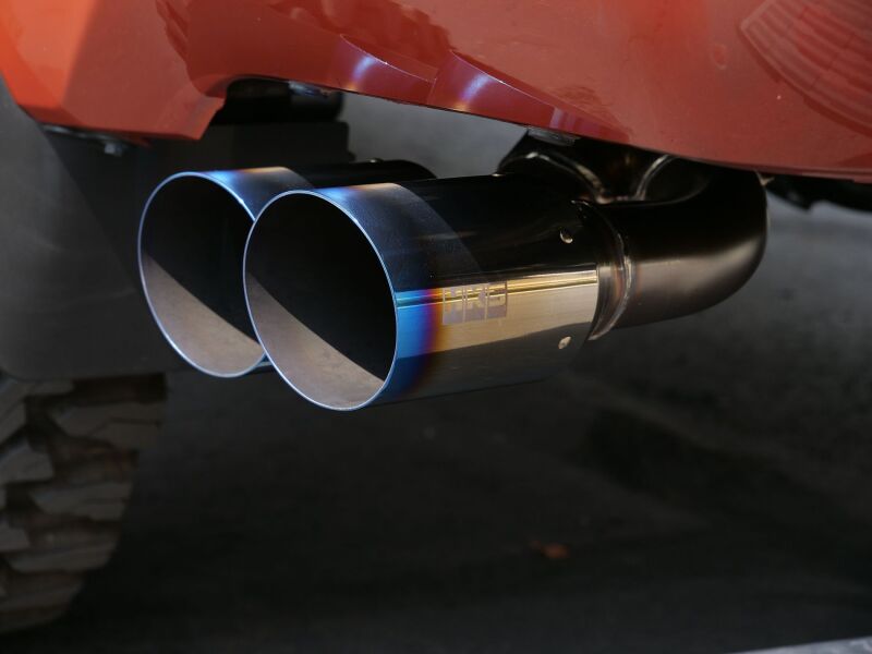 HKS Legamax Trail Master 2022 Tundra catback exhaust system with polished metal pipes and muffler, designed for off-road performance.