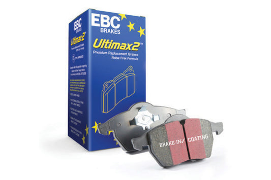 EBC Ultimax2 OE brake pads showing metal backing plates and friction material for car braking systems.