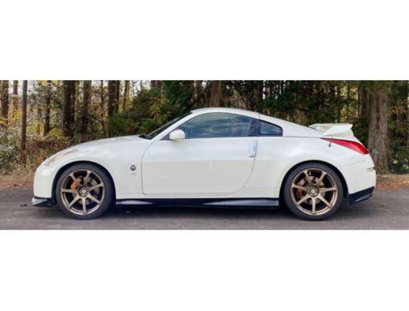 HKS Hipermax R Z33 coilover suspension kit installed on a Nissan 350Z, showing adjustable shock absorbers and coil springs