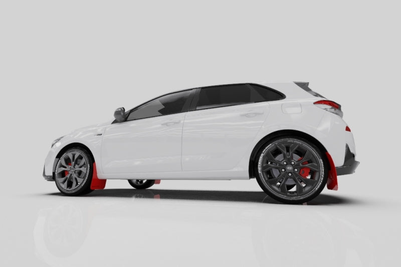 Rally Armor black mud flaps with blue logo for Hyundai Elantra GT N Line and i30, installed on vehicle wheels.