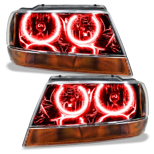 Oracle Lighting black ColorSHIFT headlights with BC1 controller installed on a Jeep Grand Cherokee 1999-2004, showcasing modern LED design.