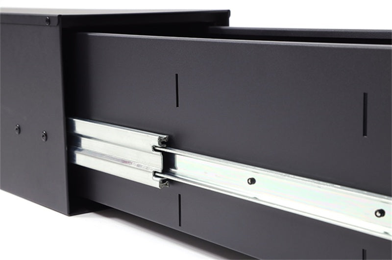 Dee Zee 60x10x10 pull-out drawer for tonneau box, tool storage solution with sturdy metal construction and easy slide mechanism.