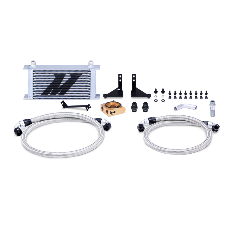 Mishimoto silver thermostatic oil cooler kit for 2014-2016 Ford Fiesta ST, featuring metal fittings and cooling fins.