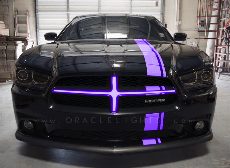 Oracle LED light strip with UV purple crosshairs for Dodge Charger 2011-2014 illuminated grille, showcasing vibrant purple lighting.