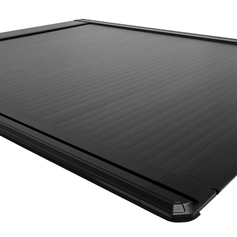 Westin retractable tonneau cover for Ford F-250/F-350 SD 6.8ft bed in black, showing the sleek, closed cover on the truck bed.