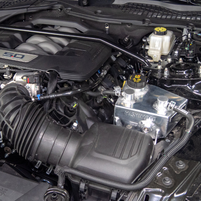 Polished Mishimoto coolant reservoir for 2024+ Ford Mustang V8 and 2.3L EcoBoost, designed as a high-quality expansion tank for engine cooling.