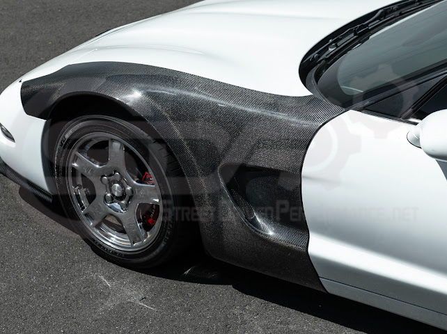 Factory style carbon fiber front and rear widebody fenders for 1997-2004 Chevrolet Corvette C5 hatchback by Street Driven Performance.