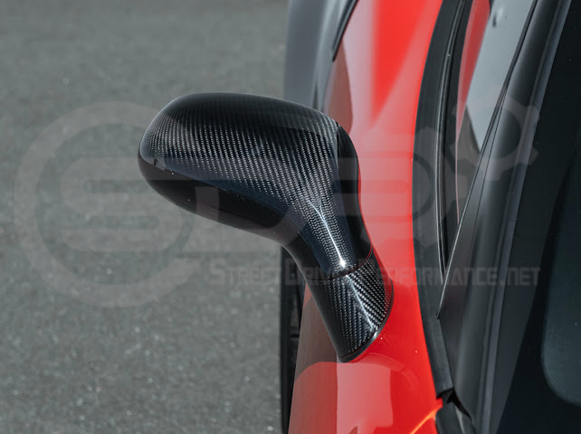 Set of four dry carbon fiber side mirror cap covers for 2005-2013 Chevy Corvette C6 by Street Driven Performance, tape-on installation.