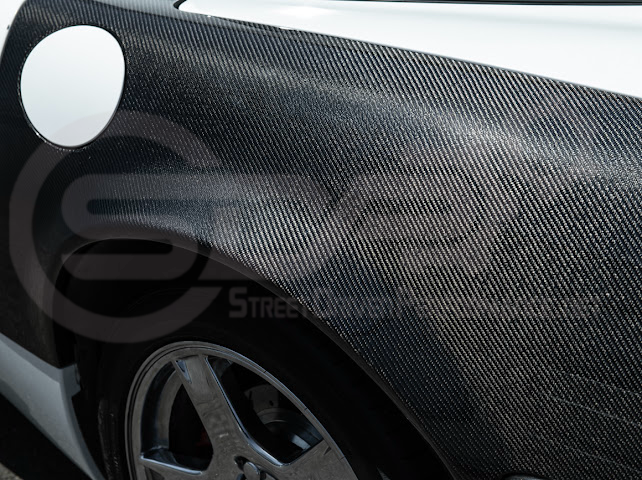 Factory style carbon fiber front and rear widebody fenders for 1997-2004 Chevrolet Corvette C5 hatchback by Street Driven Performance.