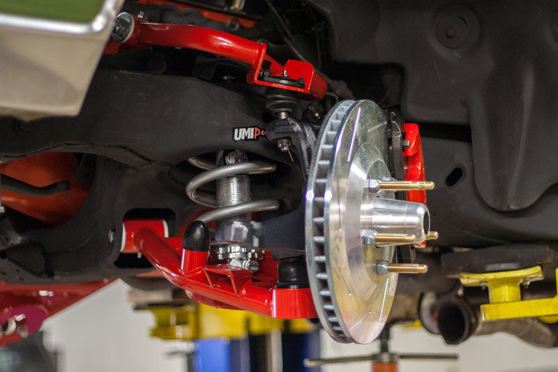 UMI Performance tubular front lower control arms for 78-88 G-Body and S10 trucks with Delrin bushings, showing the metal A-arm design.